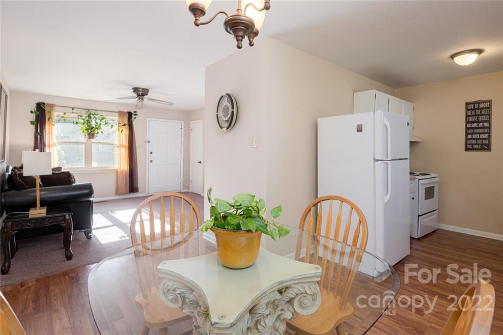 2 Eastcrest Drive Fairview, NC 28730 - Photo 11 of 32 a dining room with wooden floor and breakfast area