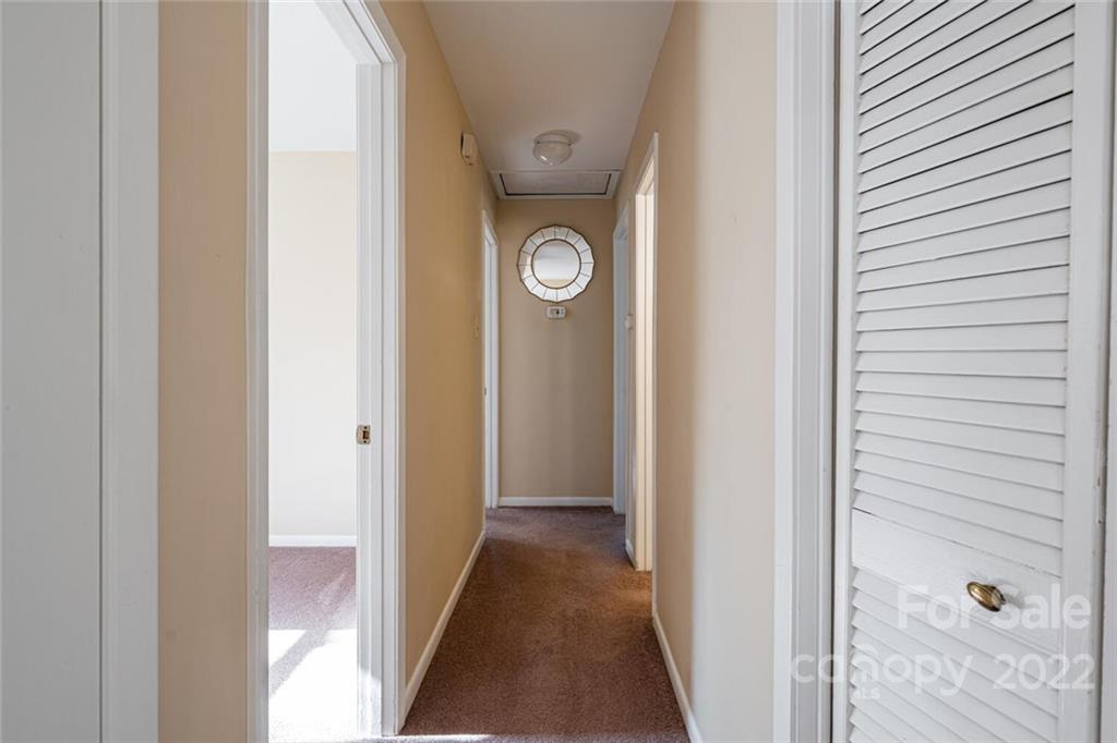 2 Eastcrest Drive Fairview, NC 28730 - Photo 16 of 32 a view of a hallway with washer and dryer