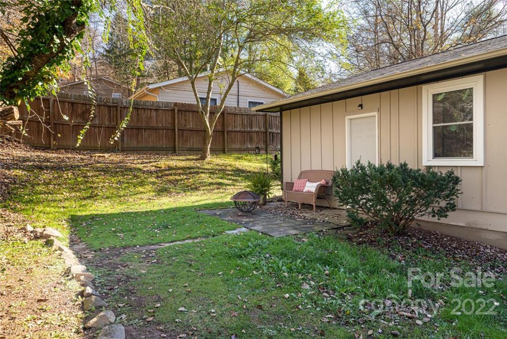 2 Eastcrest Drive Fairview, NC 28730 - Photo 27 of 32 a view of a backyard with plants and large tree