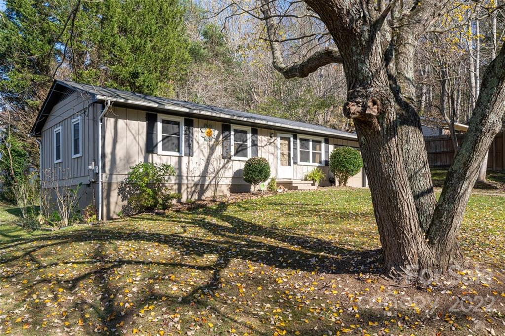 2 Eastcrest Drive Fairview, NC 28730 - Photo 29 of 32 a view of a house with a tree in a yard