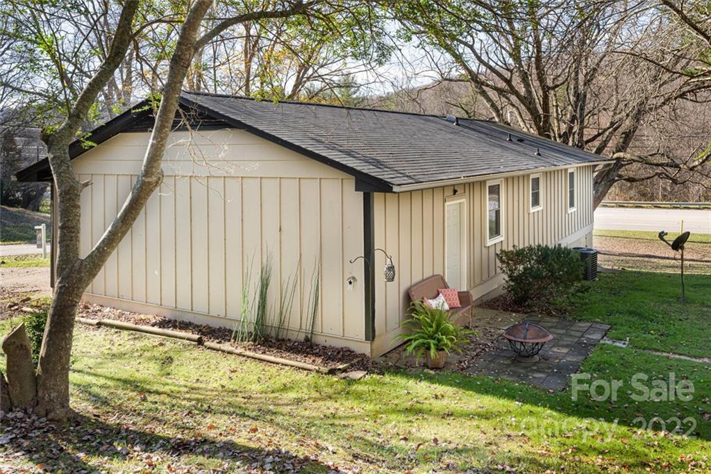 2 Eastcrest Drive Fairview, NC 28730 - Photo 31 of 32 a house with trees in front of it