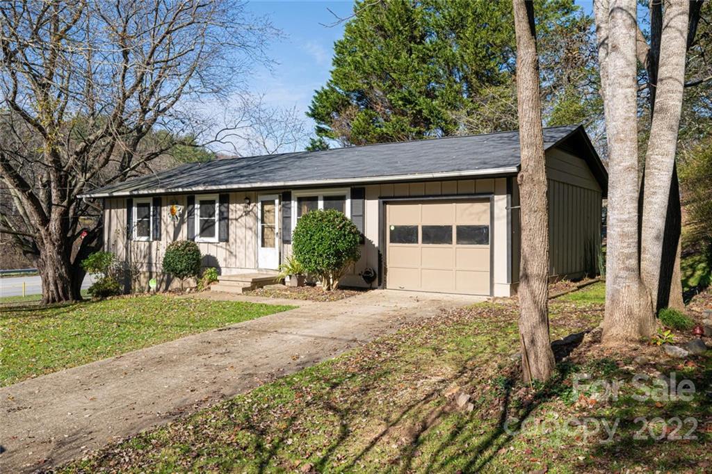 2 Eastcrest Drive Fairview, NC 28730 - Photo 32 of 32 a front view of a house with garden