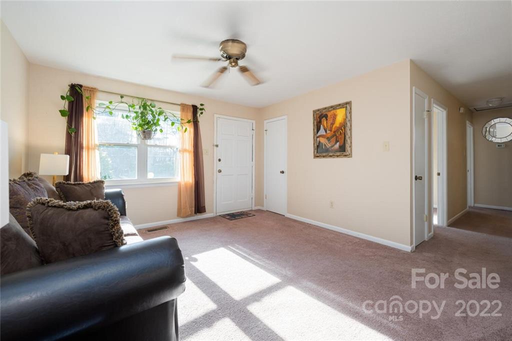 2 Eastcrest Drive Fairview, NC 28730 - Photo 8 of 32 a living room with furniture and a large window