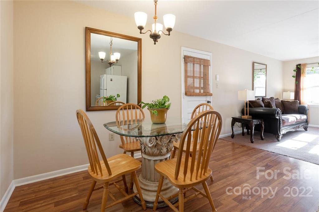 2 Eastcrest Drive Fairview, NC 28730 - Photo 10 of 32 a view of a dining room with furniture and chandelier