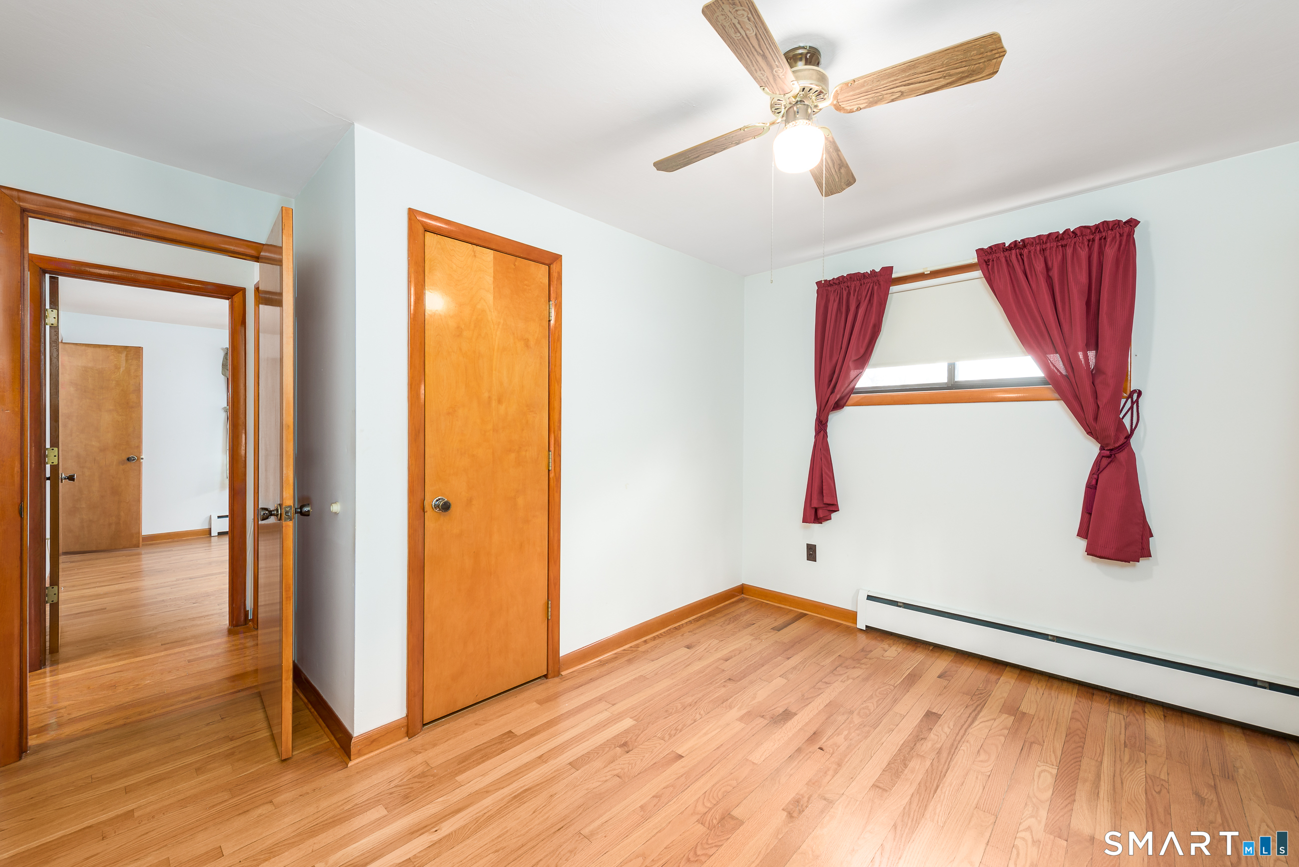 6 Saunders Lane Prospect, CT 06712 - Photo 17 of 25 a view of empty room with wooden floor and fan