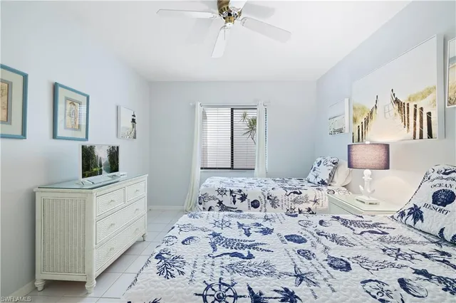 a bedroom with a bed and a dresser in it