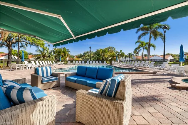 a view of balcony with furniture and outdoor seating