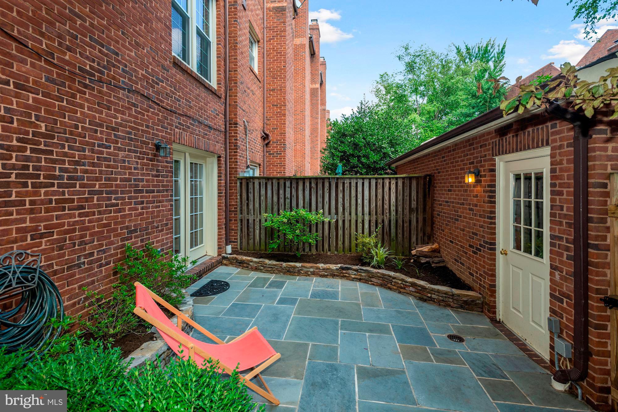 3644 Reservoir Road Northwest Washington, DC 20007 - Photo 5 of 27 Rear slate patio with detached garage