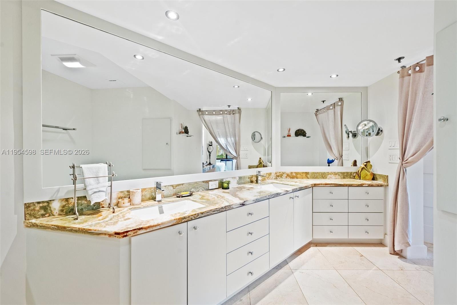 Key Biscayne Key Biscayne, FL 33149 - Photo 18 of 25 a bathroom with a granite countertop sink double vanity and a mirror