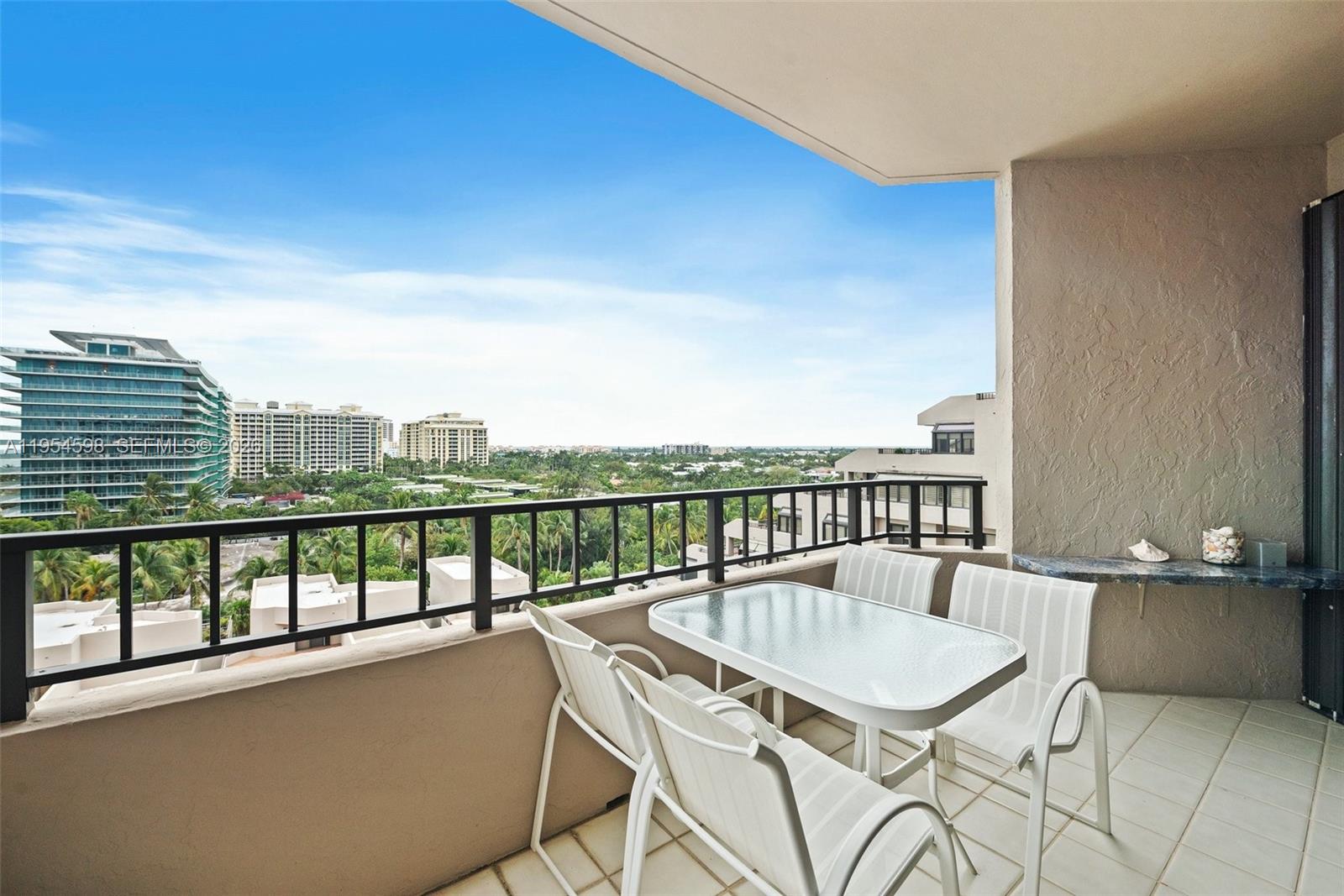 Key Biscayne Key Biscayne, FL 33149 - Photo 24 of 25 a view of a balcony with a table and chairs