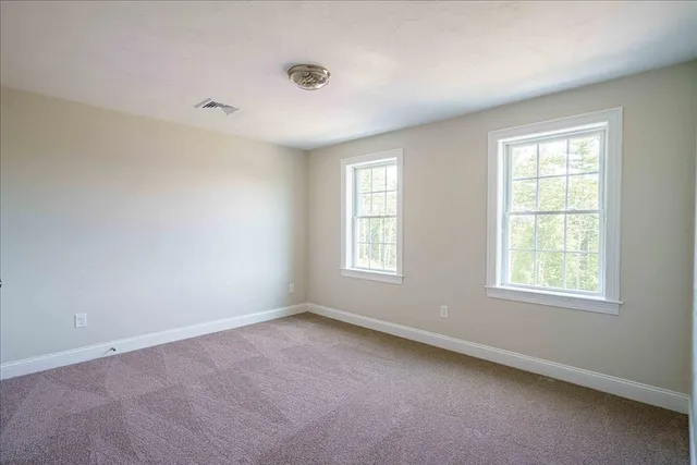 a view of an empty room and entryway
