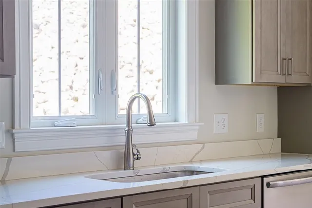 a kitchen with a sink and a window