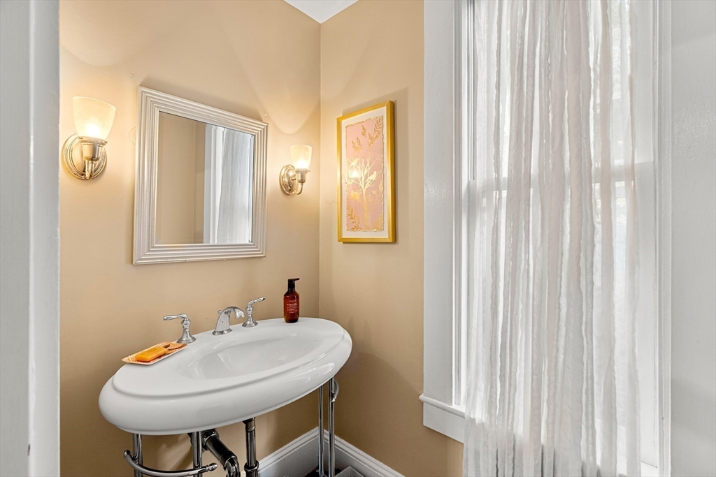 15 Harris Avenue Boston, MA 02130 - Photo 15 of 27 a bathroom with a sink and a mirror
