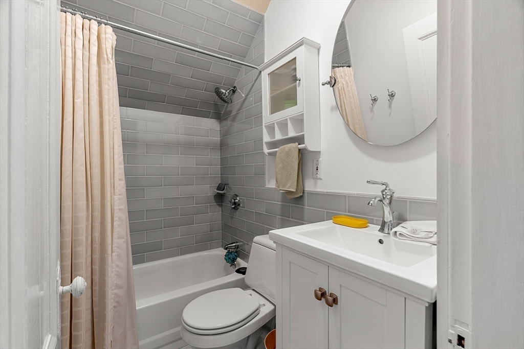 15 Harris Avenue Boston, MA 02130 - Photo 20 of 27 a bathroom with a sink a toilet and shower