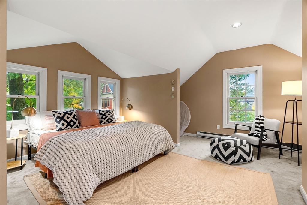 15 Harris Avenue Boston, MA 02130 - Photo 23 of 27 a bedroom with double bed and a large window