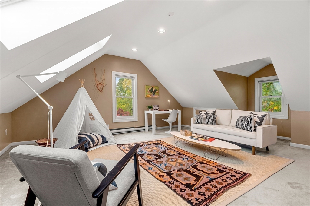 15 Harris Avenue Boston, MA 02130 - Photo 24 of 27 a living room with furniture and a rug