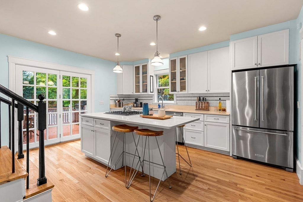 15 Harris Avenue Boston, MA 02130 - Photo 10 of 27 a kitchen with stainless steel appliances granite countertop a sink a stove and a refrigerator