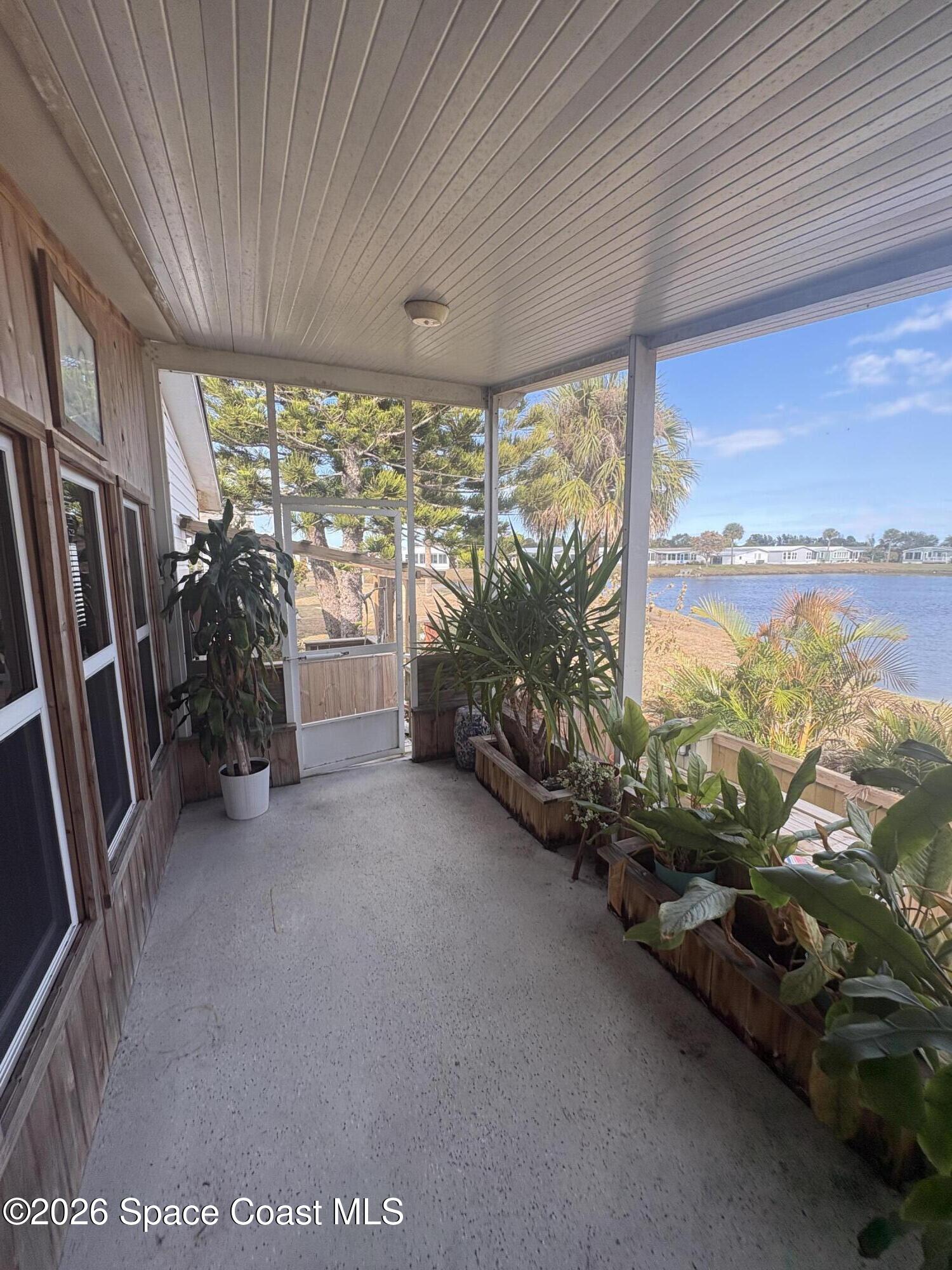 7625 Longhorn Avenue, Unit P3 Micco, FL 32976 - Photo 1 of 40 a view of a garage