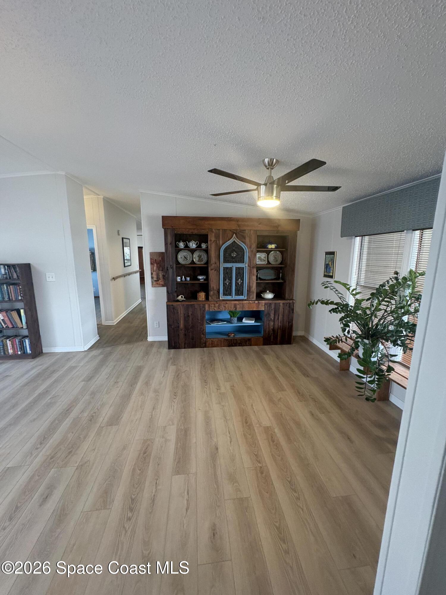 7625 Longhorn Avenue, Unit P3 Micco, FL 32976 - Photo 17 of 40 a view of a livingroom with furniture and a potted plant