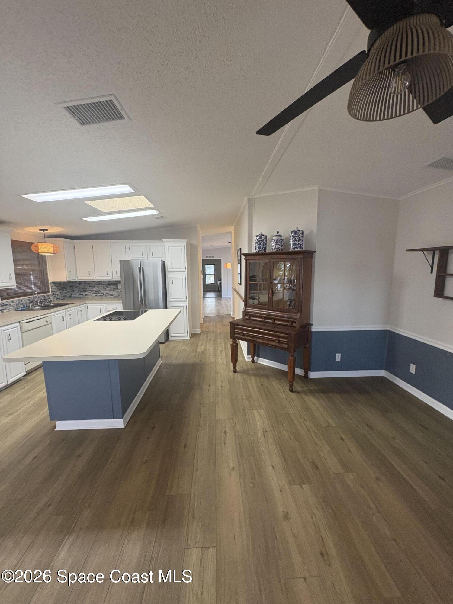 7625 Longhorn Avenue, Unit P3 Micco, FL 32976 - Photo 20 of 40 a living room with furniture and a wooden floor