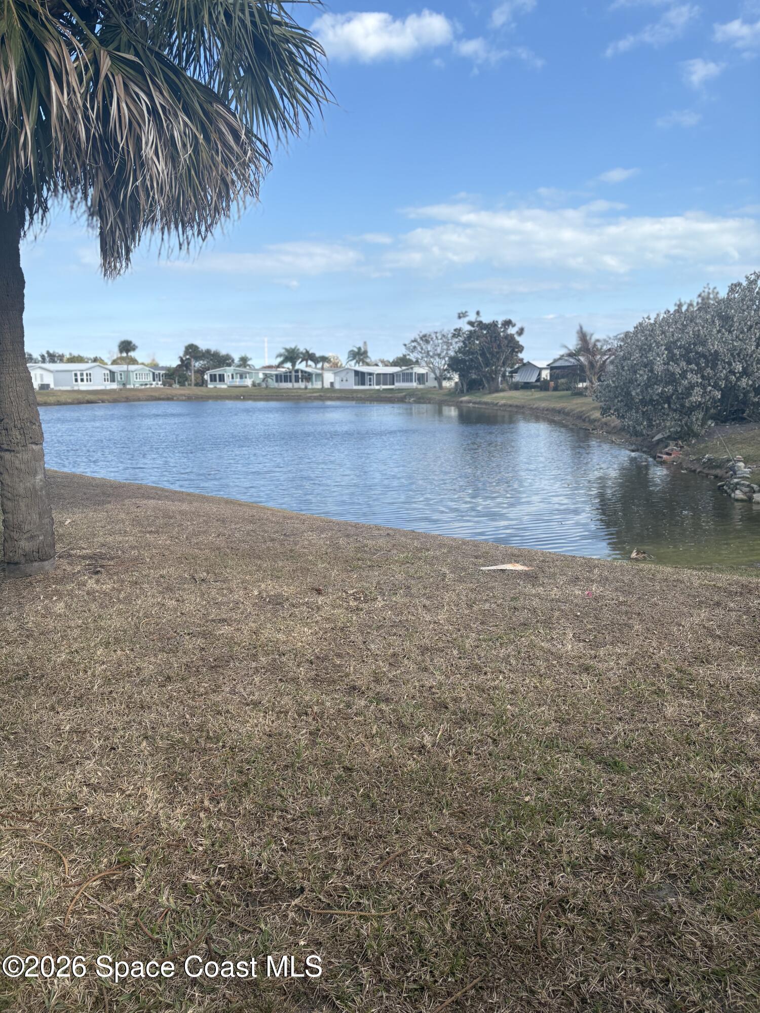 7625 Longhorn Avenue, Unit P3 Micco, FL 32976 - Photo 37 of 40 a view of a lake view