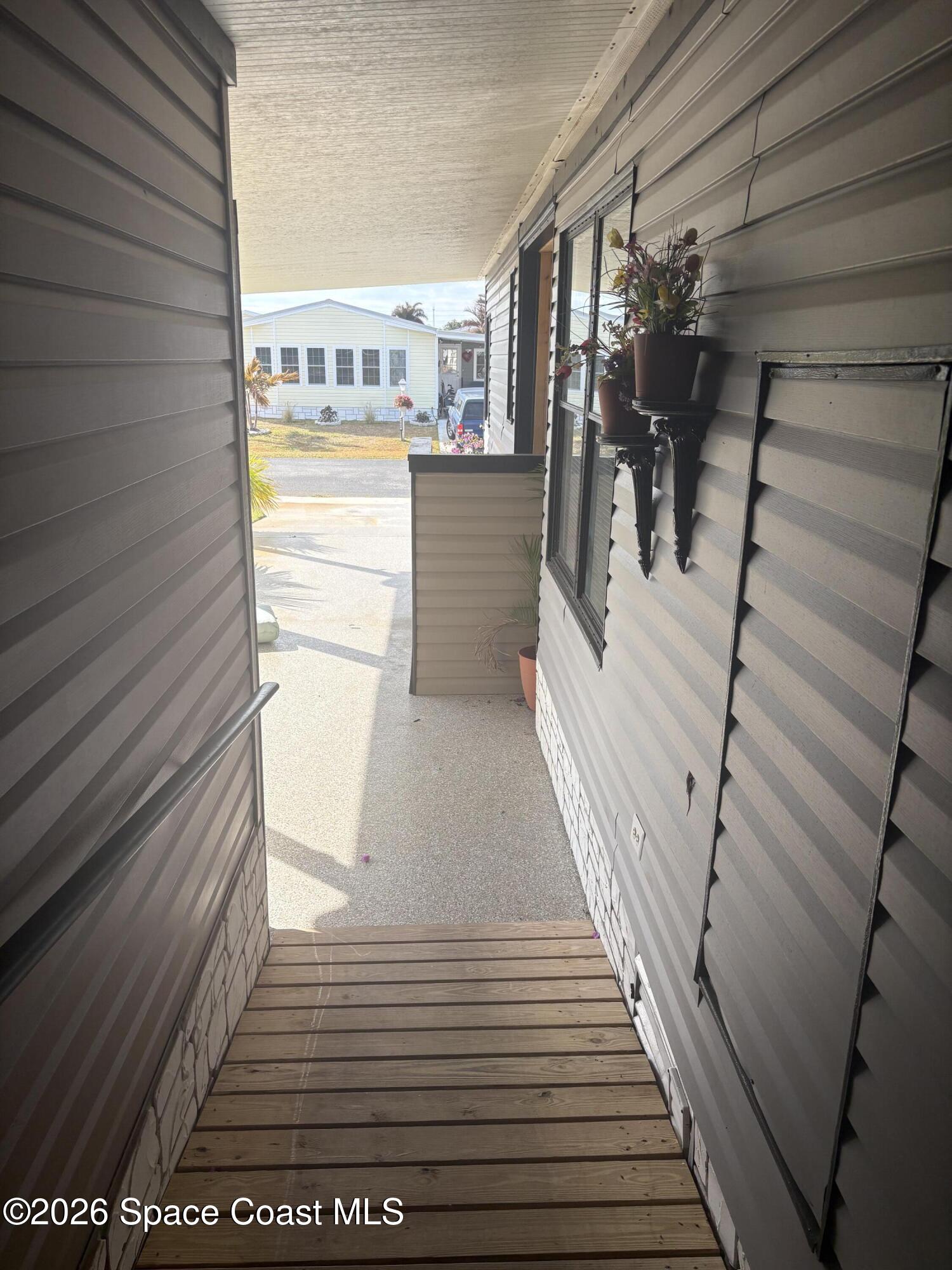 7625 Longhorn Avenue, Unit P3 Micco, FL 32976 - Photo 38 of 40 a view of a balcony with an outdoor space