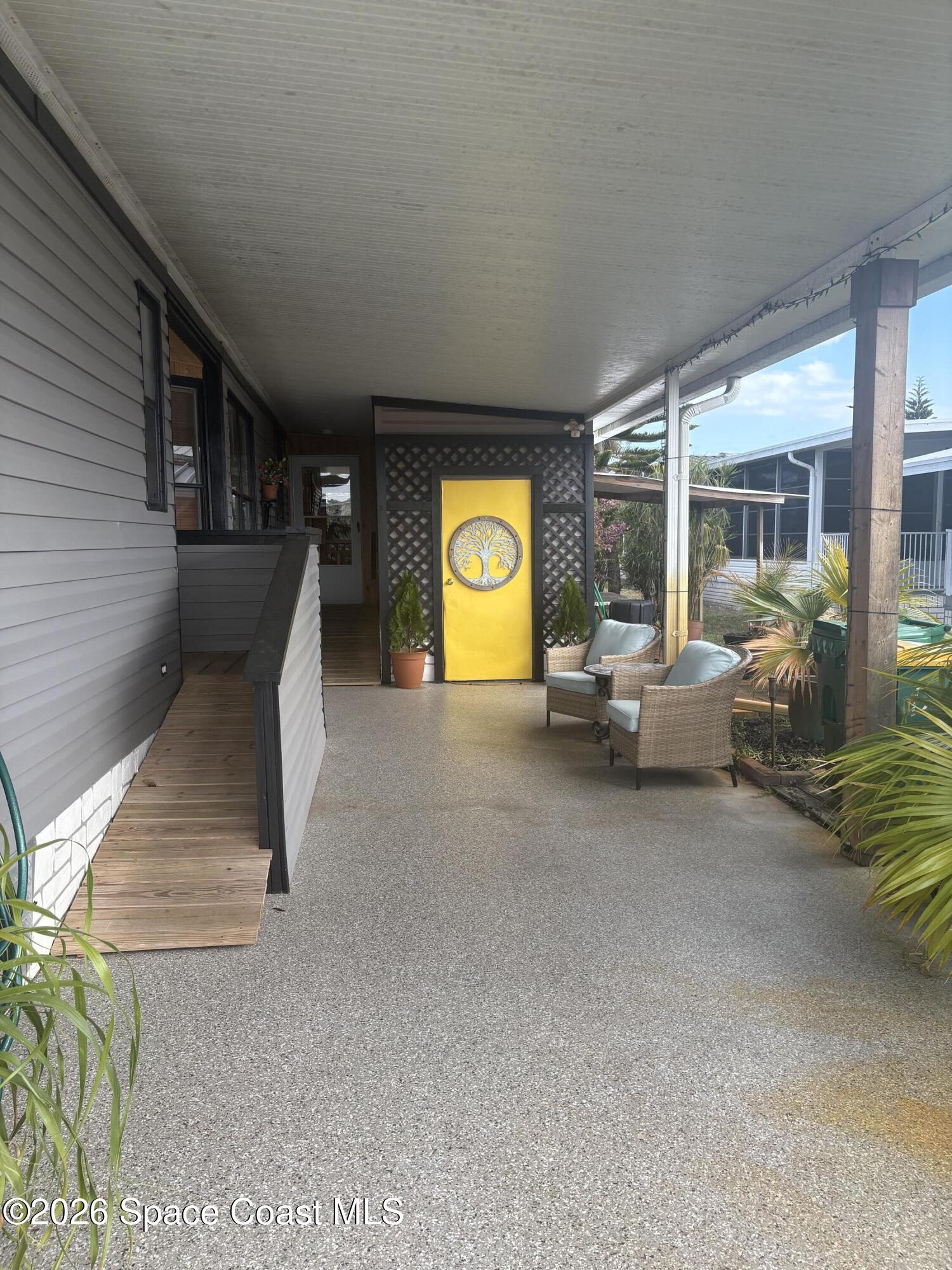 7625 Longhorn Avenue, Unit P3 Micco, FL 32976 - Photo 6 of 40 a view of living room with furniture and window