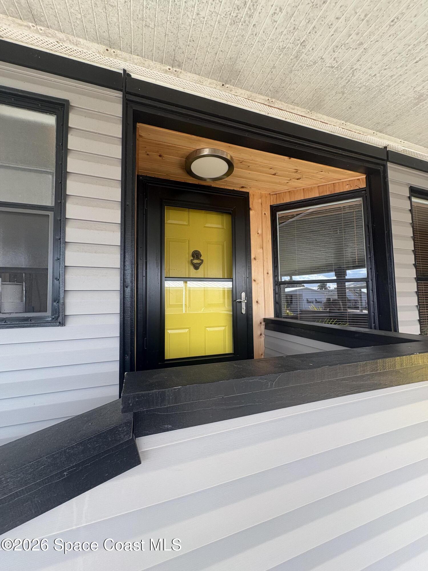 7625 Longhorn Avenue, Unit P3 Micco, FL 32976 - Photo 7 of 40 a view of a living room that has a fireplace