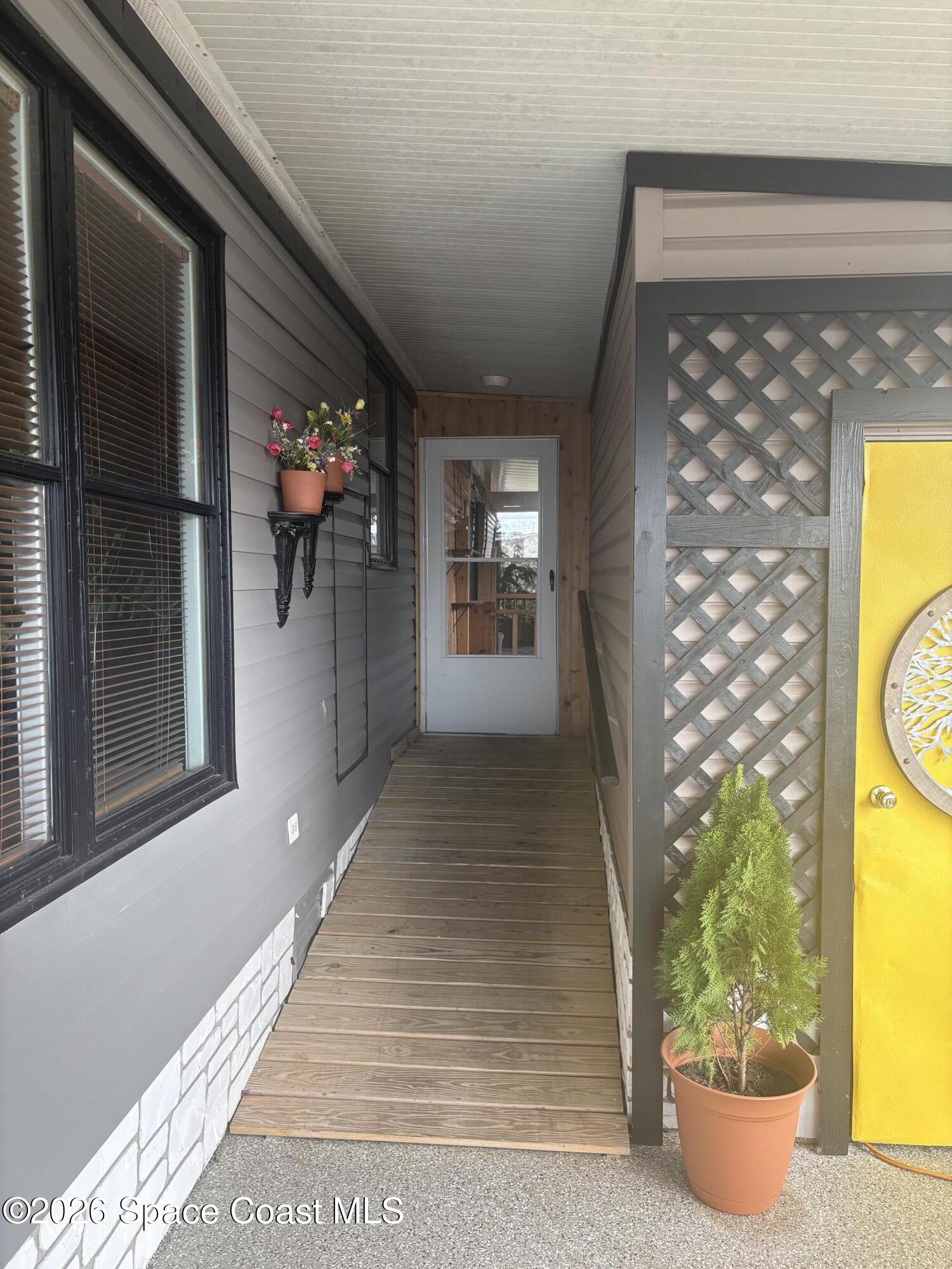 7625 Longhorn Avenue, Unit P3 Micco, FL 32976 - Photo 8 of 40 a view of a entryway door front of a house