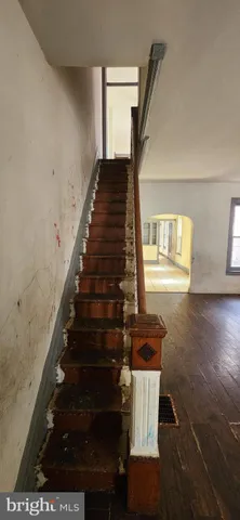 a view of an entryway with wooden floor