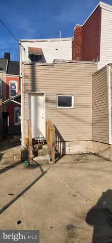 a view of a back yard of the house