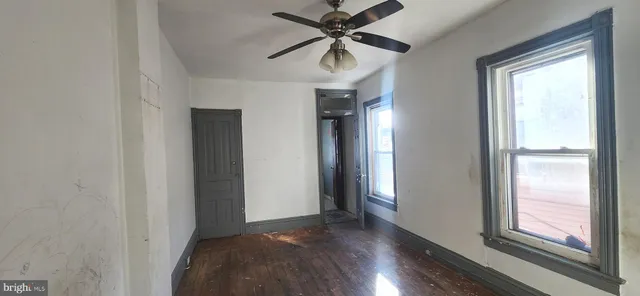 a bathroom with a tub a sink and mirror