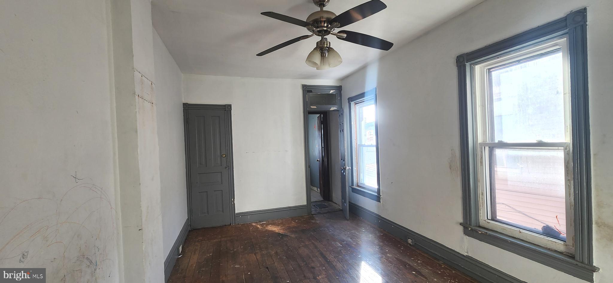120 West Buttonwood Street Reading, PA 19601 - Photo 10 of 21 a view of empty room with wooden floor and fan
