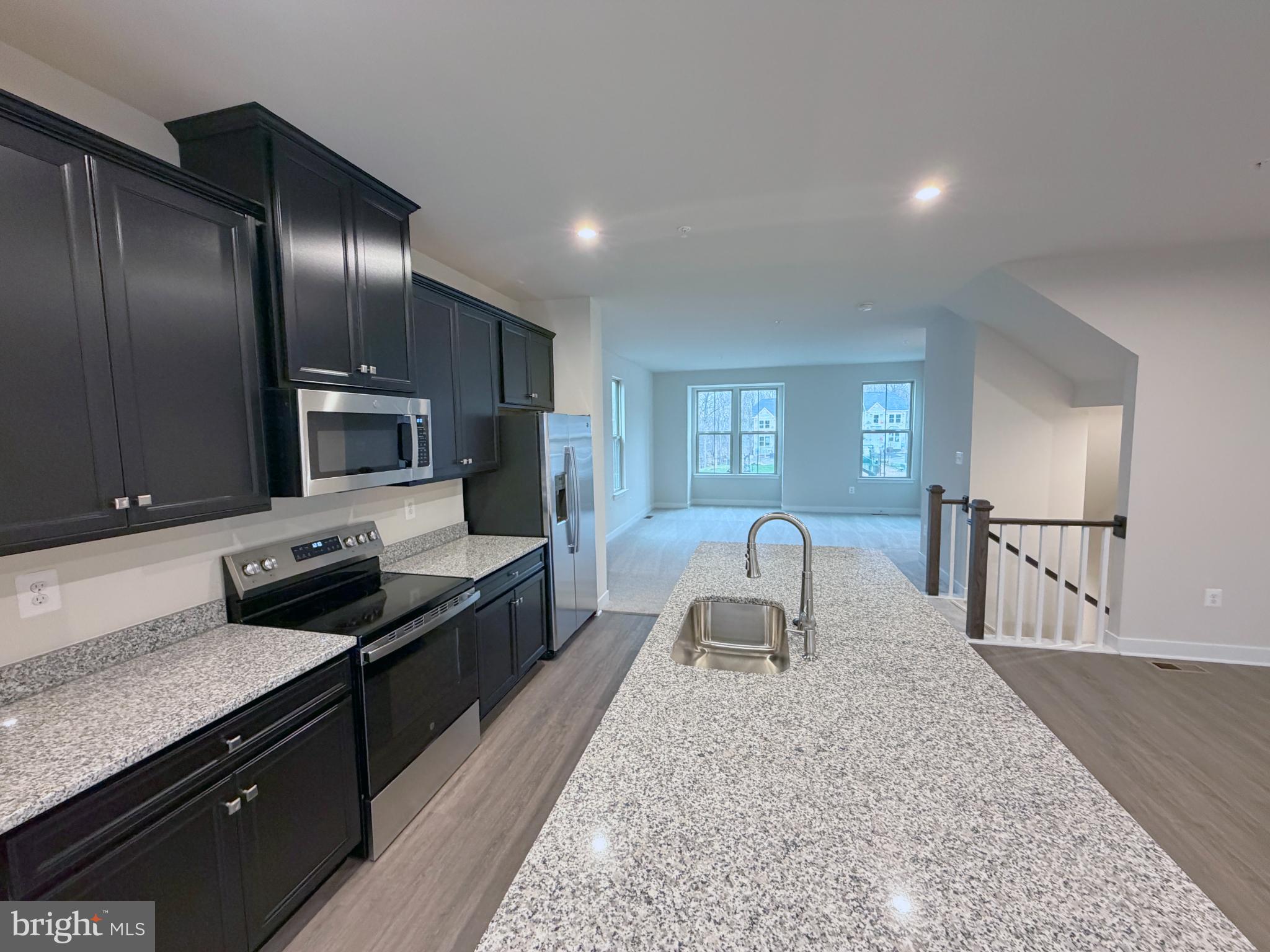 9331 Klamath Court Frederick, MD 21701 - Photo 12 of 28 a kitchen with stainless steel appliances granite countertop a sink stove and refrigerator