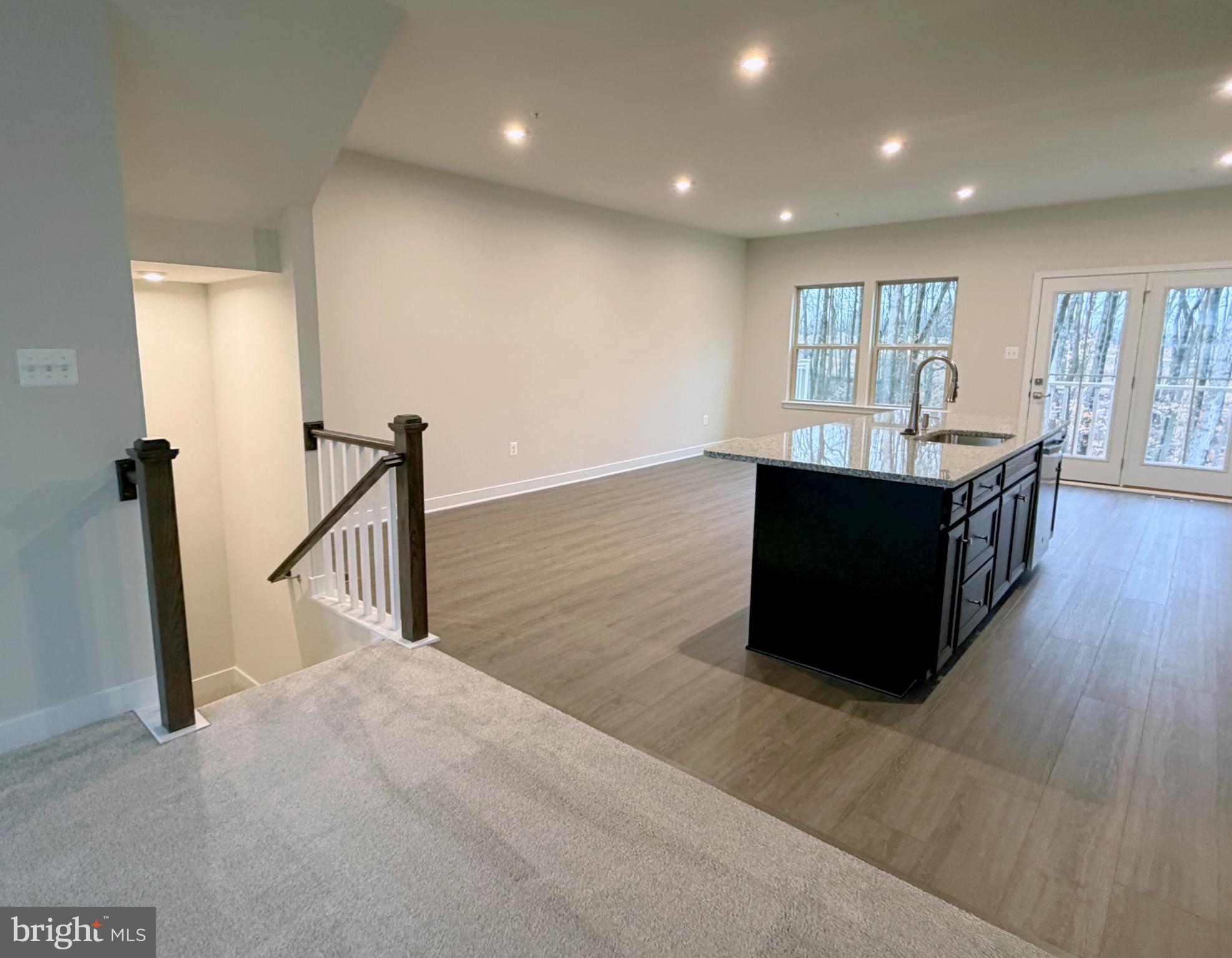 9331 Klamath Court Frederick, MD 21701 - Photo 14 of 28 a hall with wooden floor and a ceiling fan