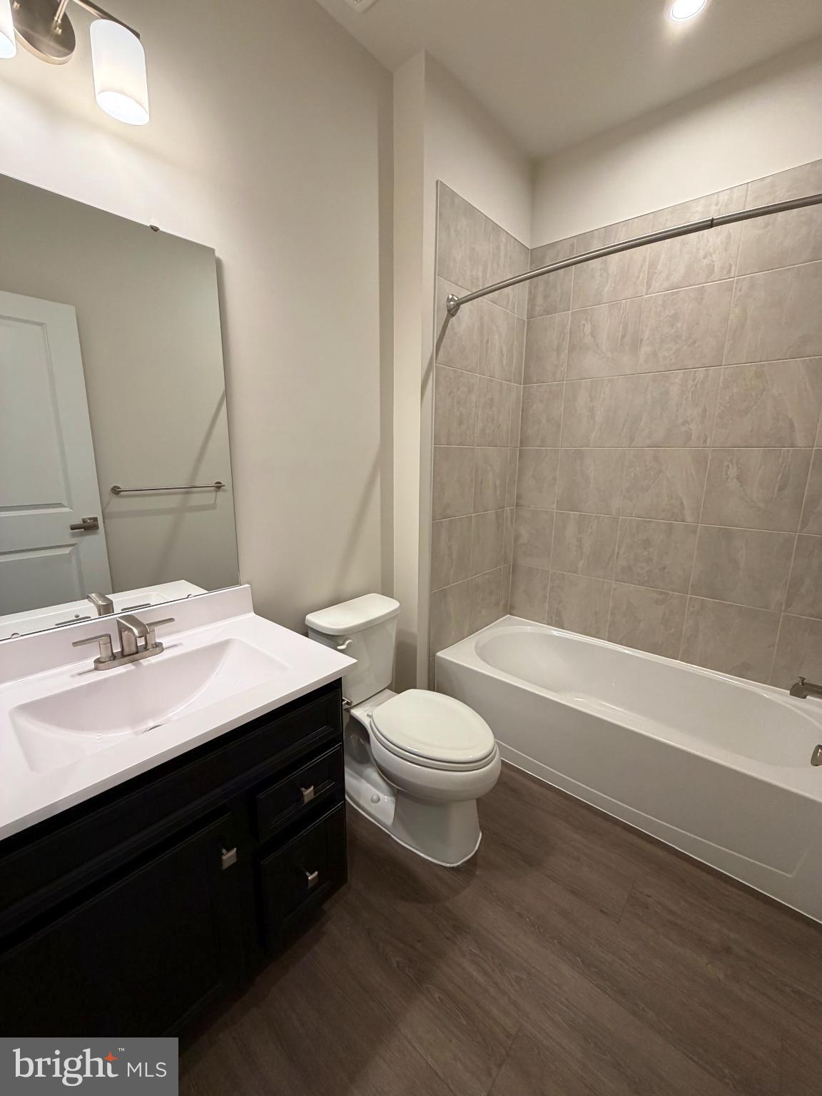 9331 Klamath Court Frederick, MD 21701 - Photo 18 of 28 a bathroom with a sink a toilet and shower