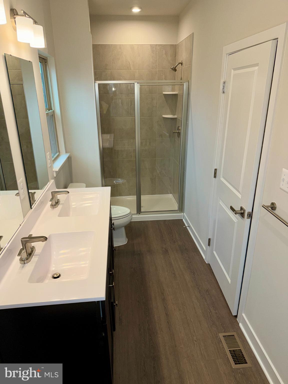 9331 Klamath Court Frederick, MD 21701 - Photo 23 of 28 a bathroom with a sink a toilet and shower