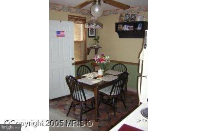 1649 Naturo Road Baltimore, MD 21286 - Photo 1 of 4 a dining room with furniture and wooden floor