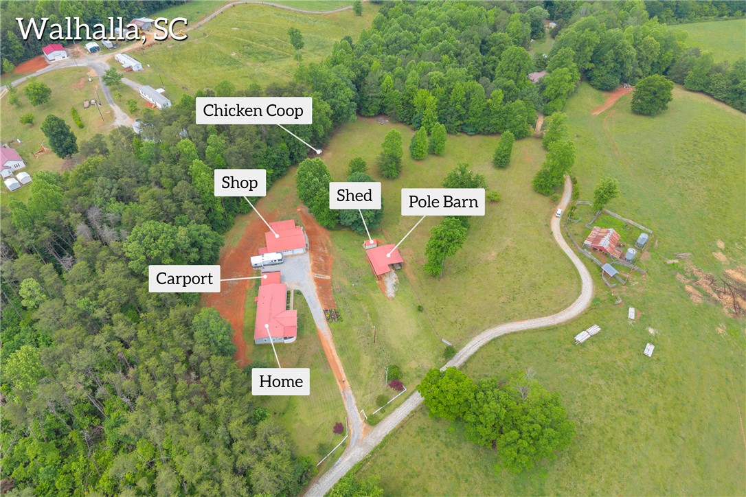 721 Cedar Crest Trail Walhalla, SC 29691 - Photo 44 of 47 An aerial perspective reveals a vast landscape with a primary residence, workshop, carport, chicken coop, shed, and pole barn.