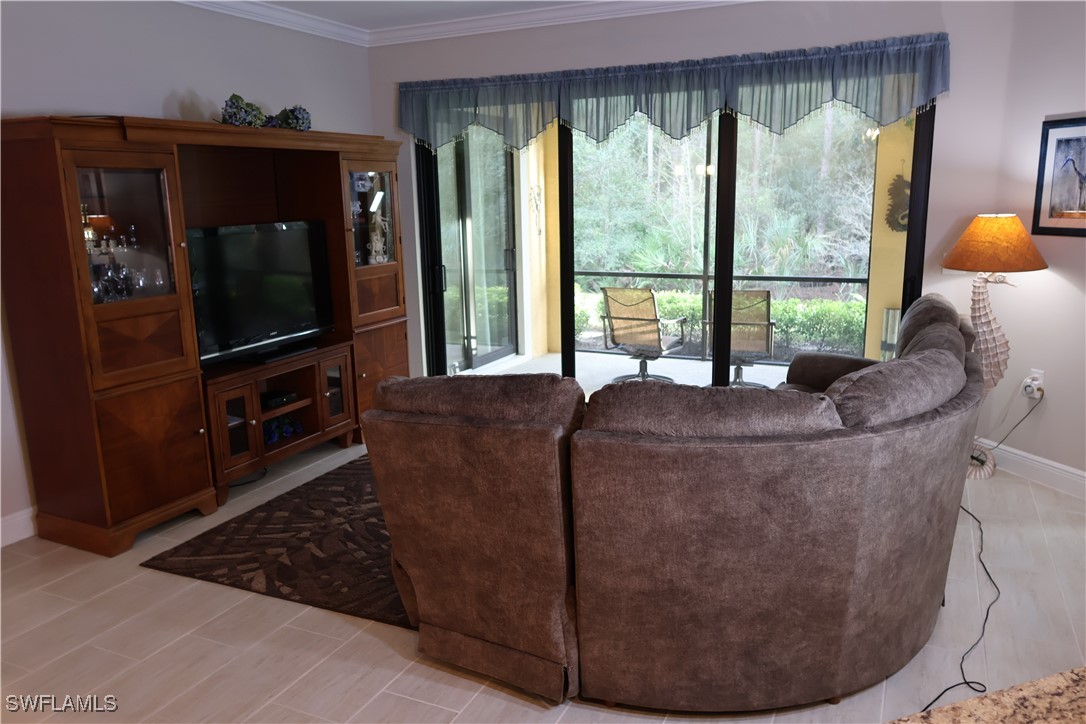 10459 Casella Way, Unit 102 Fort Myers, FL 33913 - Photo 12 of 29 a view of living room with furniture and a flat screen tv