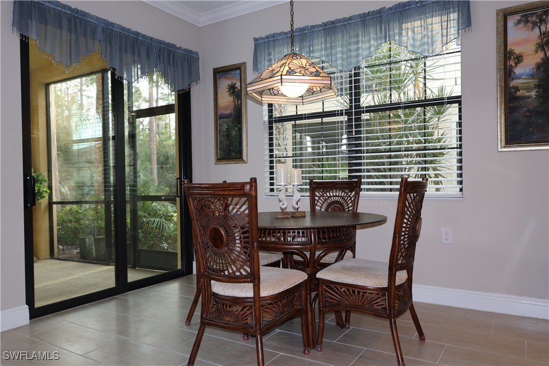 10459 Casella Way, Unit 102 Fort Myers, FL 33913 - Photo 14 of 29 a view of a dining room with furniture window and outside view