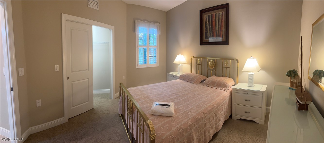 10459 Casella Way, Unit 102 Fort Myers, FL 33913 - Photo 18 of 29 a bedroom with a bed and a window