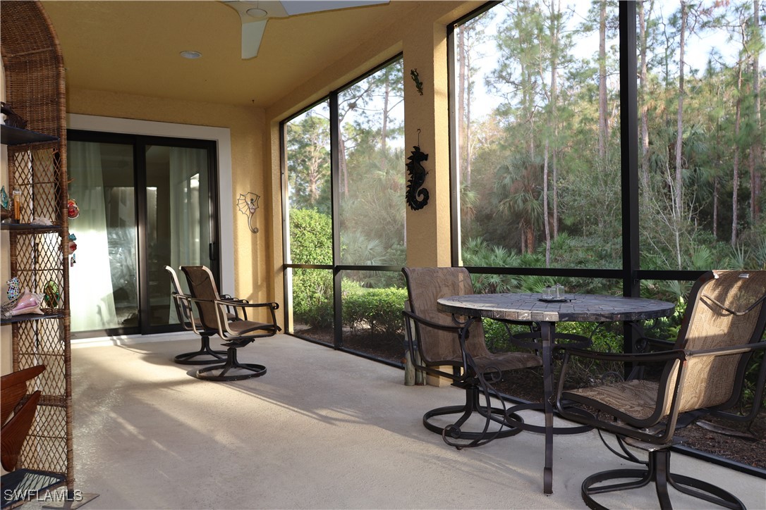 10459 Casella Way, Unit 102 Fort Myers, FL 33913 - Photo 23 of 29 a view of a room with gym equipment and floor to ceiling window