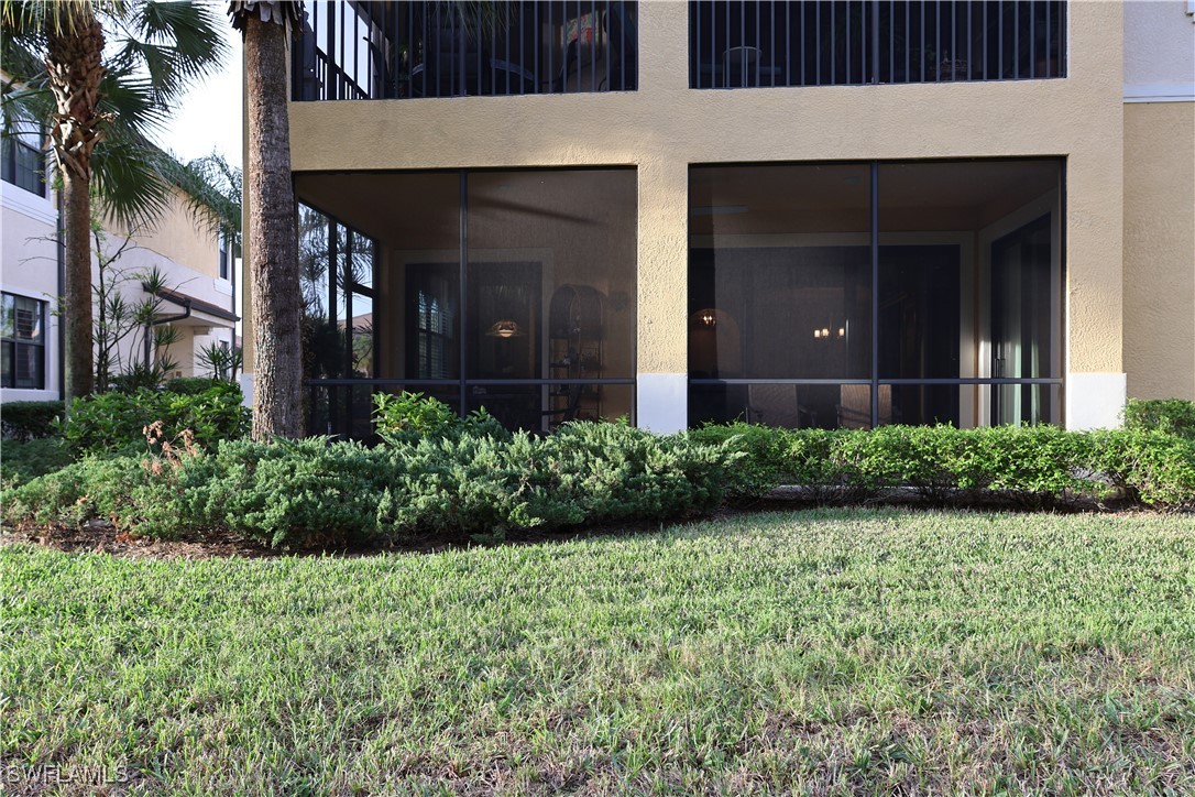 10459 Casella Way, Unit 102 Fort Myers, FL 33913 - Photo 24 of 29 a view of a house with a garden and plants