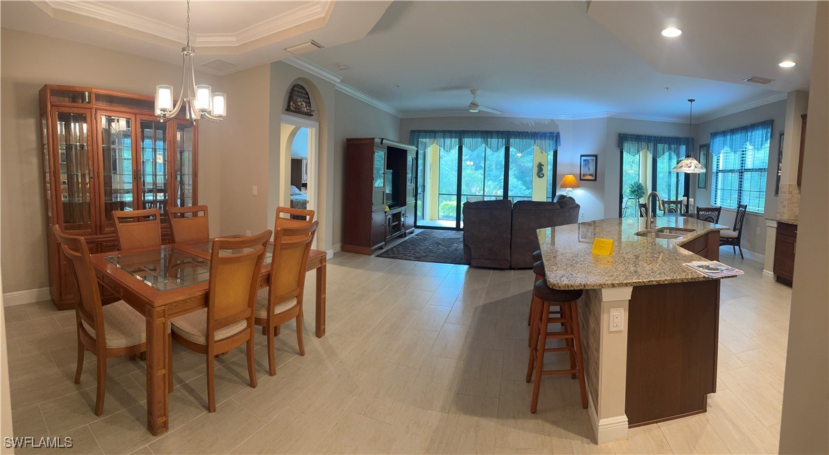 10459 Casella Way, Unit 102 Fort Myers, FL 33913 - Photo 6 of 29 a view of a dining room with furniture window and outside view