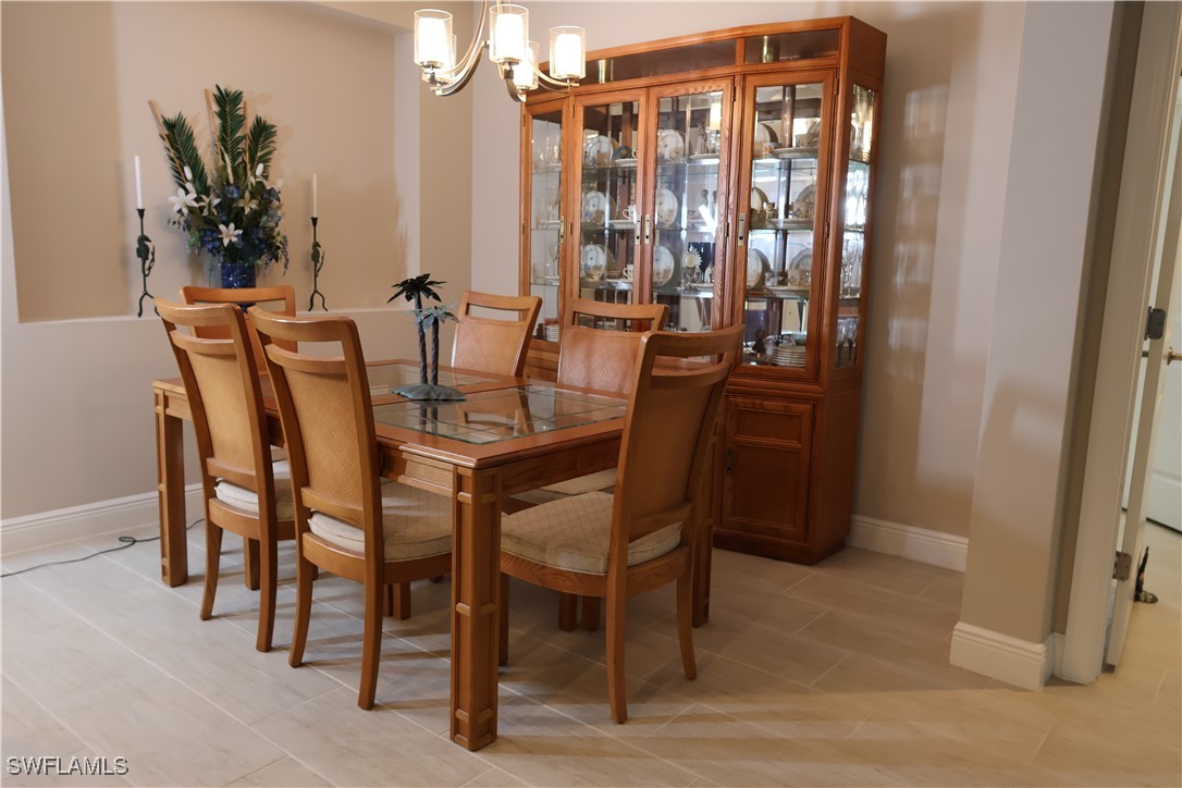 10459 Casella Way, Unit 102 Fort Myers, FL 33913 - Photo 10 of 29 a view of a dining room with furniture and window