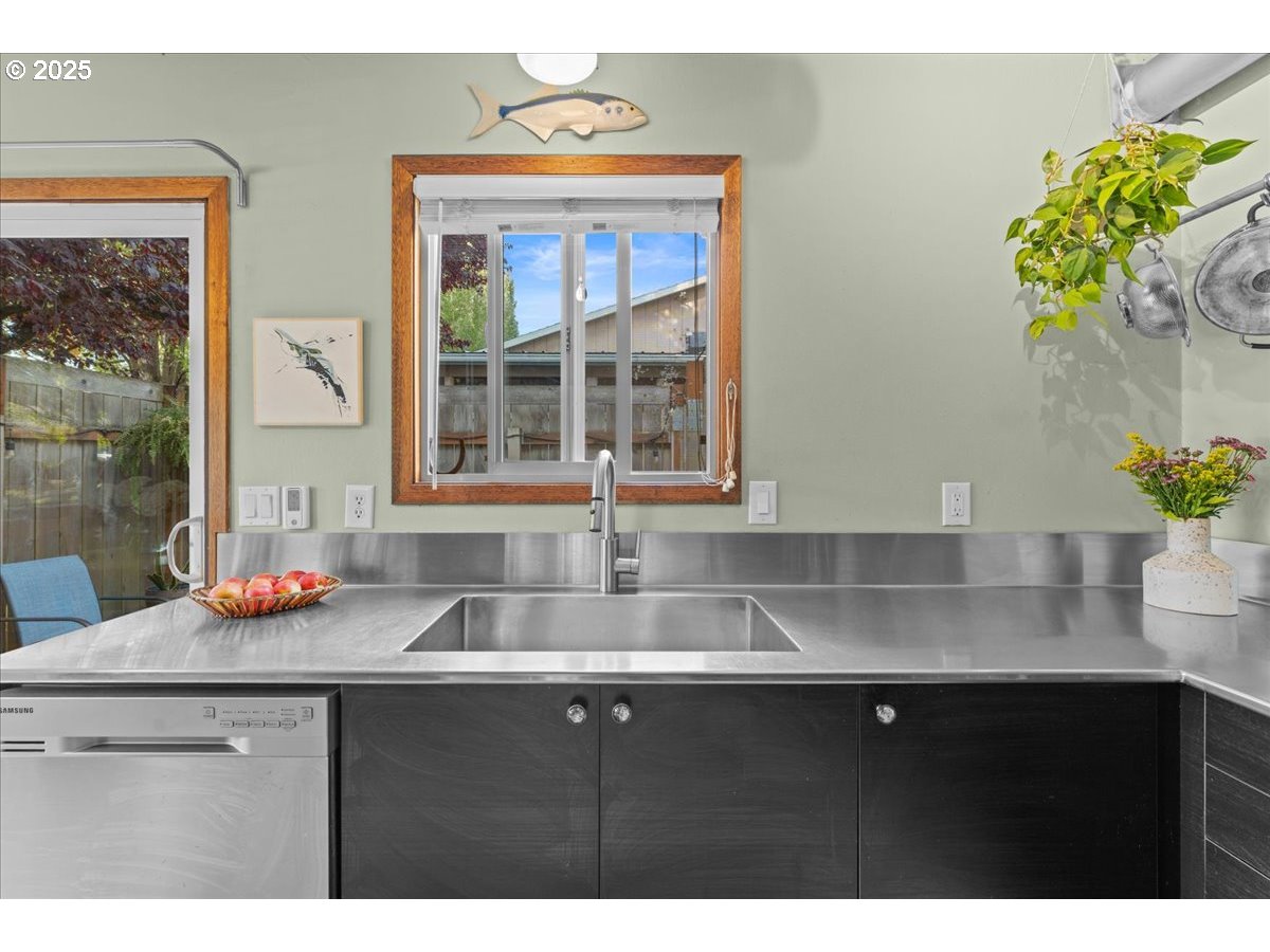 3837 North Juneau Street Portland, OR 97203 - Photo 10 of 32 a kitchen with a sink and a potted plant
