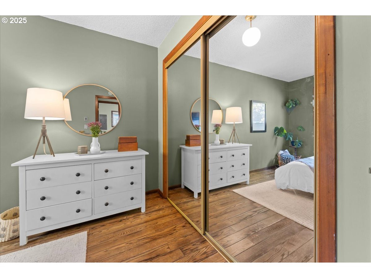 3837 North Juneau Street Portland, OR 97203 - Photo 15 of 32 a spacious bedroom with a bed and a dresser