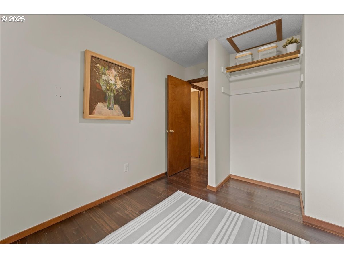 3837 North Juneau Street Portland, OR 97203 - Photo 20 of 32 an empty room with wooden floor