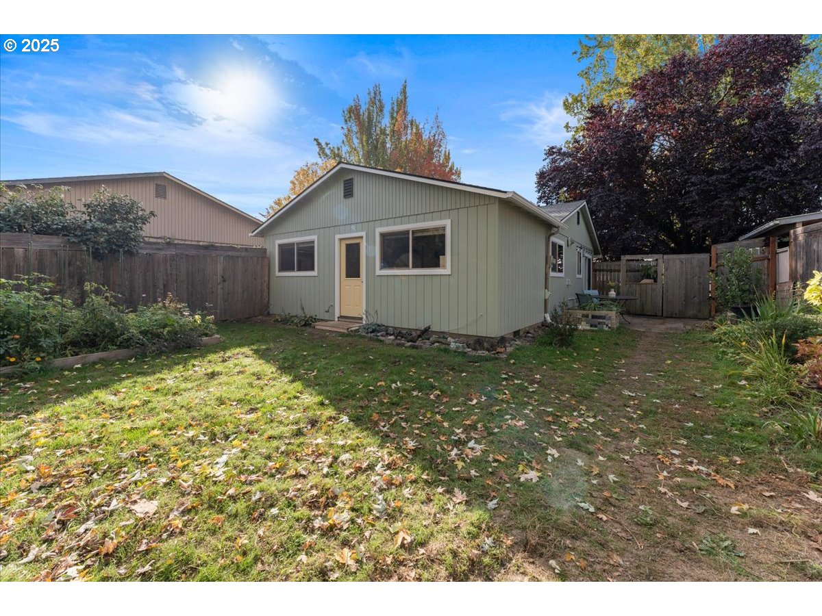 3837 North Juneau Street Portland, OR 97203 - Photo 24 of 32 a house with a yard